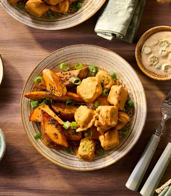 Tofu in jalapeño crust with coconut-peanut sauce and okra